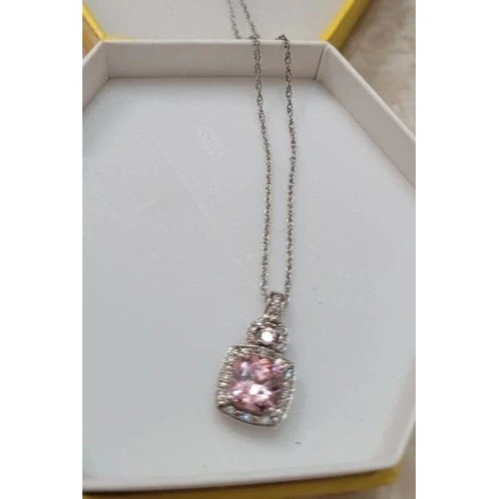 Beautiful silver toned necklace with pink stone